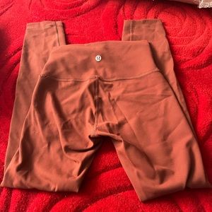 Lululemons rust color crops size 2. Never worn no tags